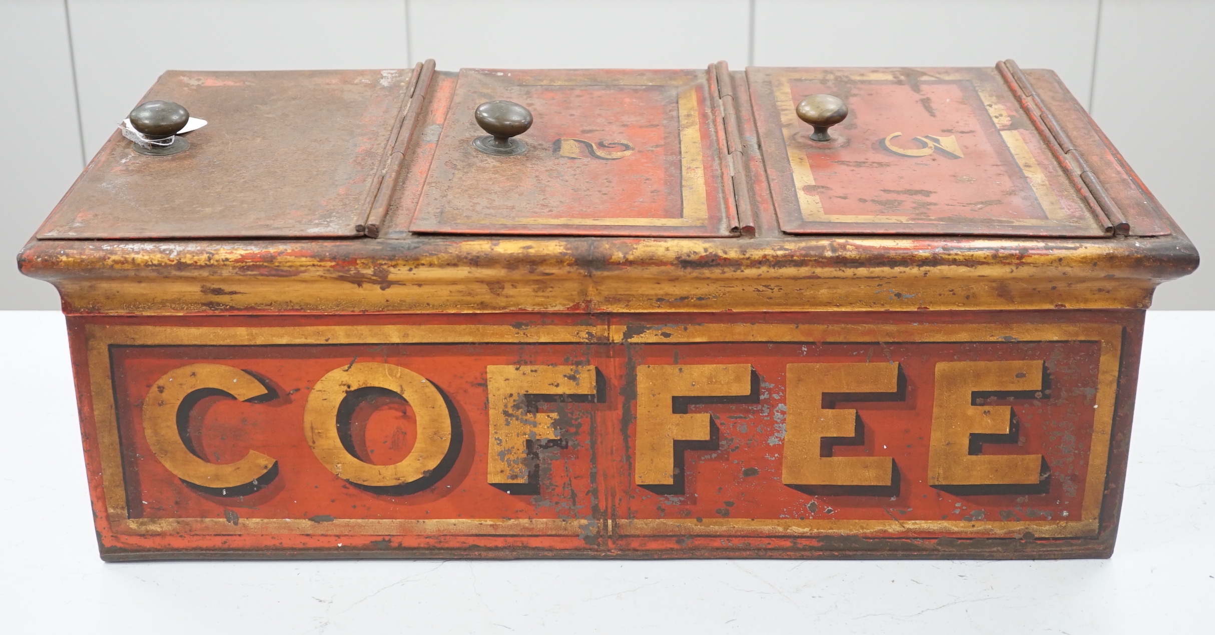 A Victorian painted retailer's advertising coffee tin with three compartments, 64cm wide